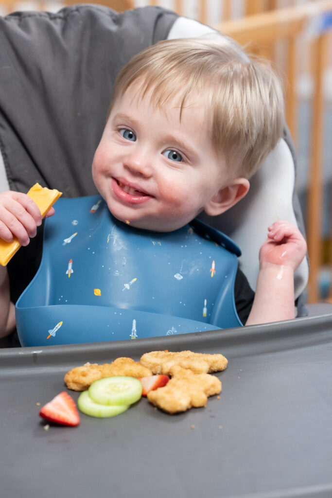 Infant eating food at Duck Pond Day Care